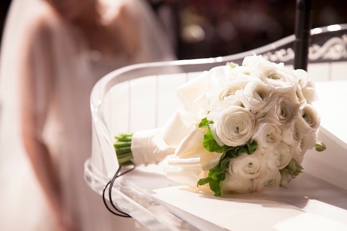 Photo of a wedding bouquet of white roses
