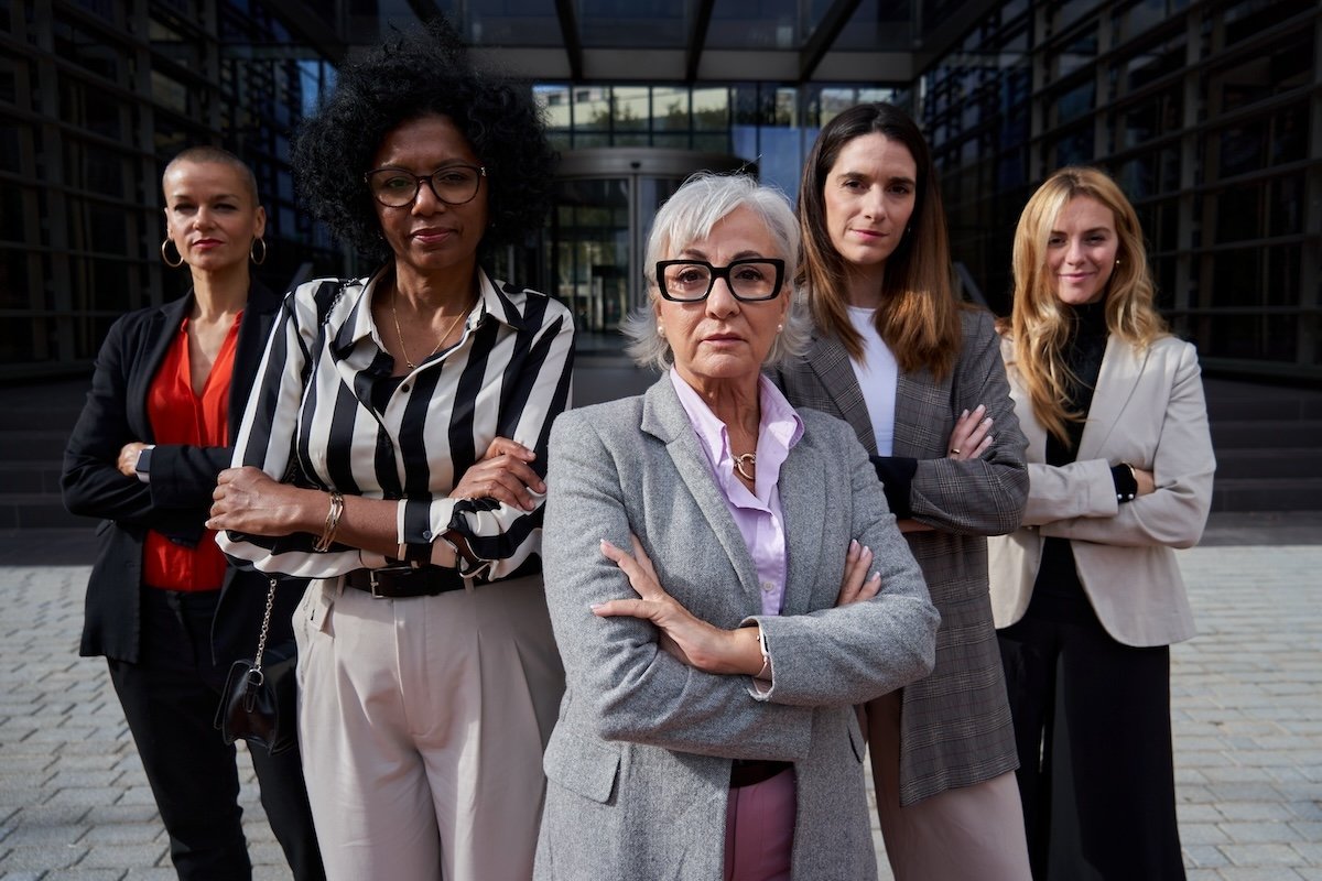 Confident group of multi-ethnic businesswomen looking at camera seriously