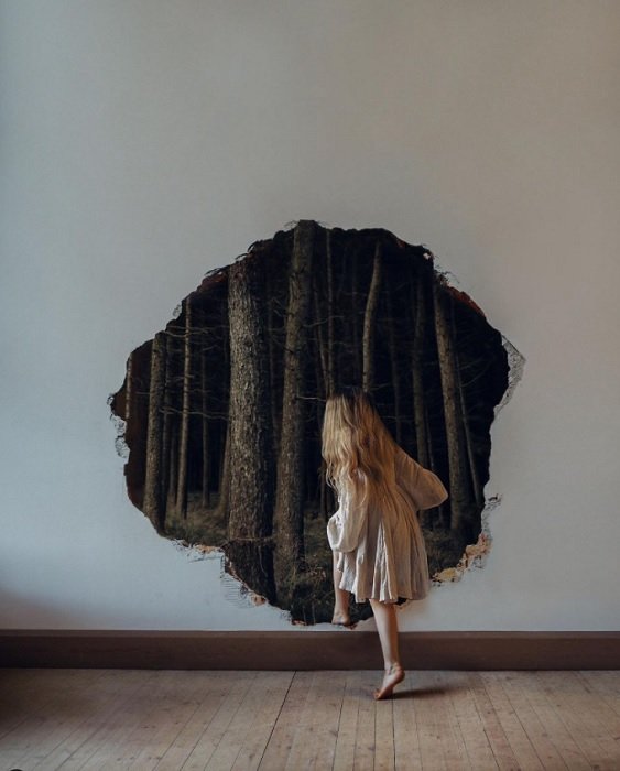Woman walking through hole in the wall into dark forest as an idea for fairy tale photography