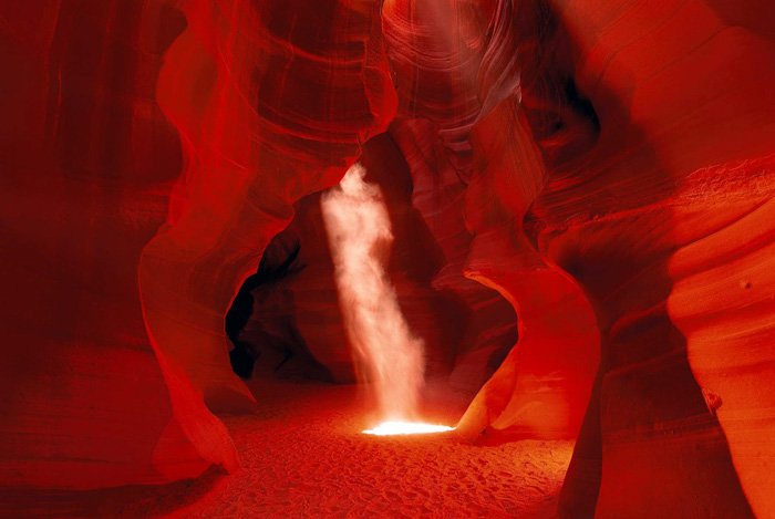 Color photo of dust cloud in cave