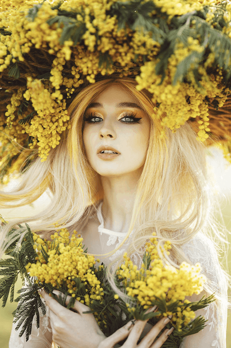 Porrait of a woman with a headpiece of yellow flowers