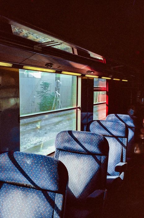 Film photo of blue train seats as an example of rhythm in aesthetic photography