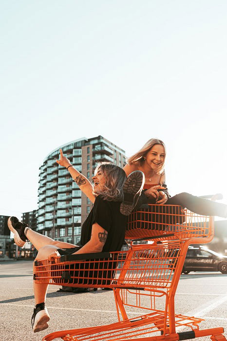 Fashion portrait of two friends posing. modern lifestyle.two stylish sexy  hipster girls best friends ready for party.Two young girl friends standing  together and having fun. Looking at camera. Stock-foto | Adobe Stock