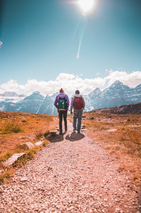 Two backpackers walking in the mountains
