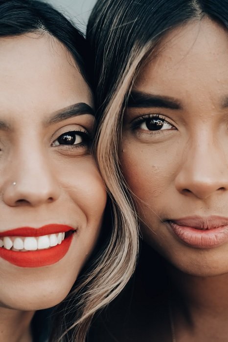 Close-crop portrait of two women face to face
