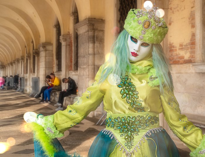 Venice carnival masked model after adding a fake bokeh effect in Photohsop