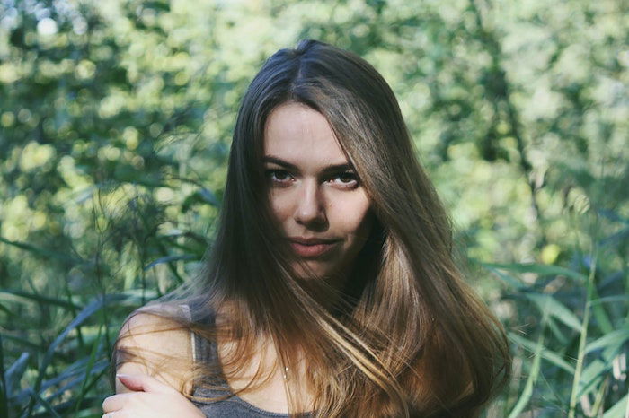 Female headshot with her facing the camera