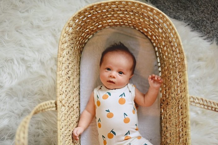 Baby in wicker basket as newborn photo idea