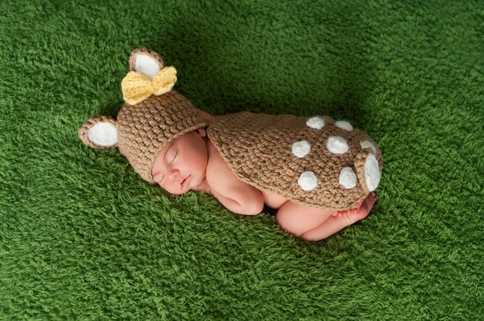 Baby girl in deer costume as a newborn photo idea
