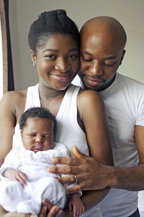 Portrait of mother, father, and newborn