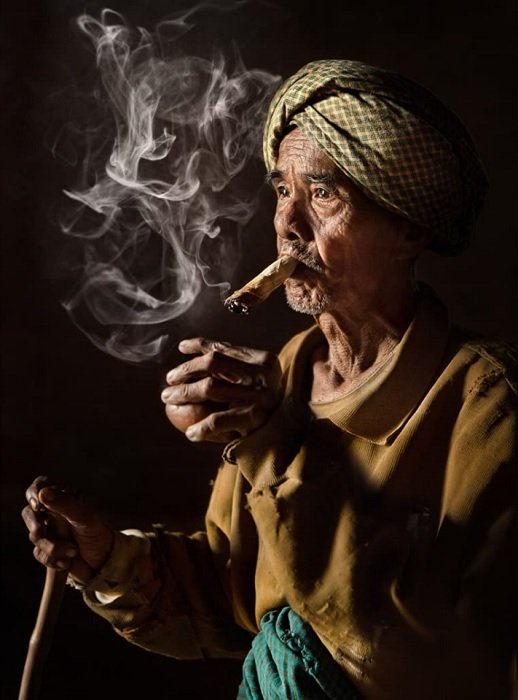 portrait of an old man smoking a pipe