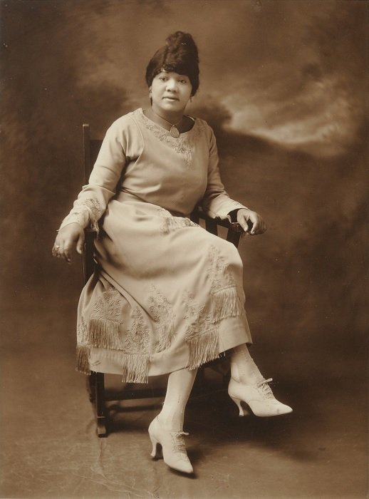 Black and white print of lady in a white dress