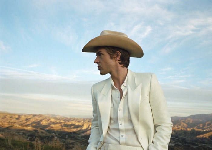 portrait of a man in cowboy hat in the desert