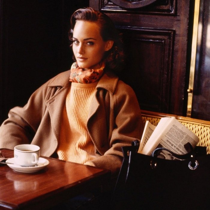 portrait of a woman sitting in a cafe