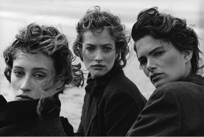 portrait of three models on a beach 