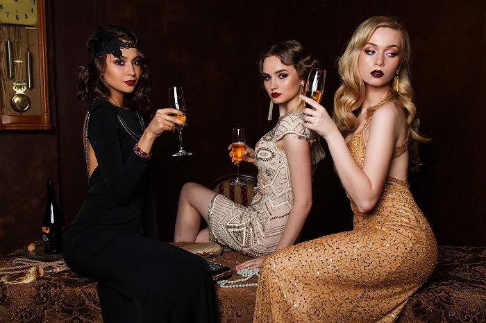 stock photo of three woman dressed in elegant clothing