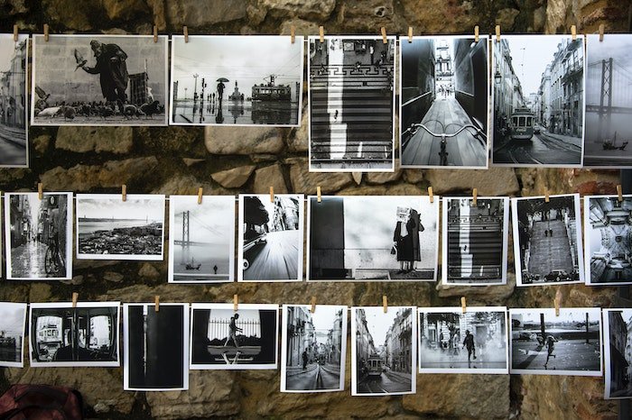 A selection of photo prints hang after processing