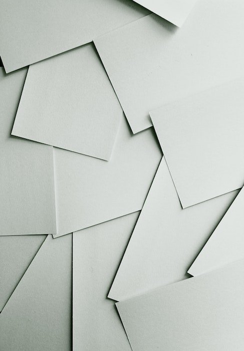 A shot of a pile of paper that is scattered and layered