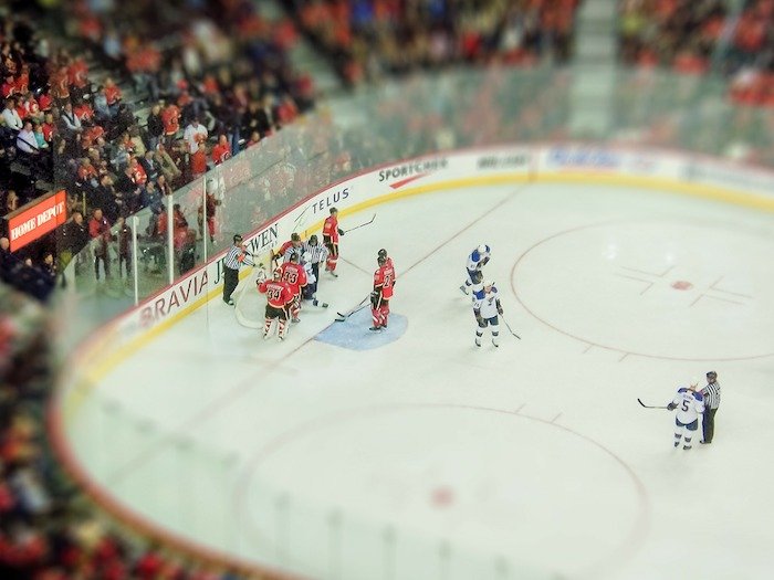 A tilt shift photography example of an ice hockey stadium in miniature