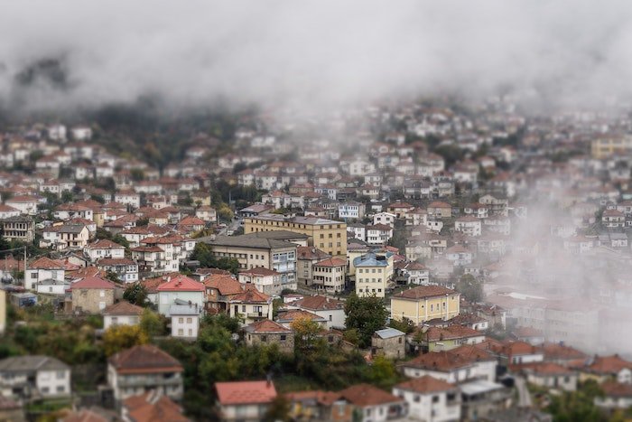 A shot of a misty city made to look like tiny models as an example of tilt-shift photography