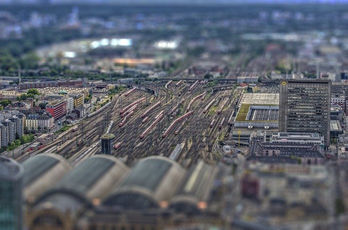 A miniature view of a train station and train line