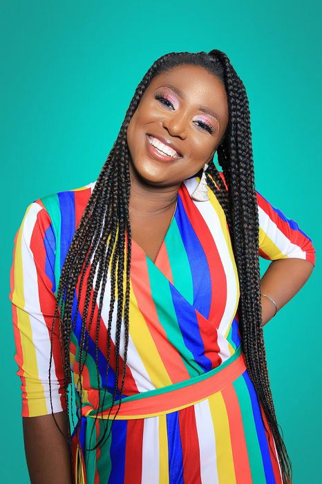 Portrait of Girl with braided hair in colorful striped dress