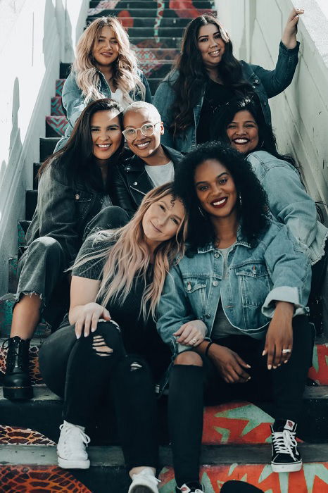 Group of young women sitting on some stairs 