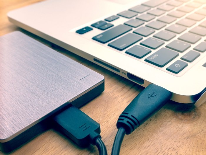 External hard drive connected to a laptop with USB