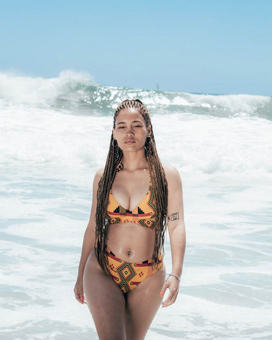 beautiful local latin model posing at the beach wearing a bikini with the  sunset behind her for a back-lit high contrast image Stock Photo - Alamy