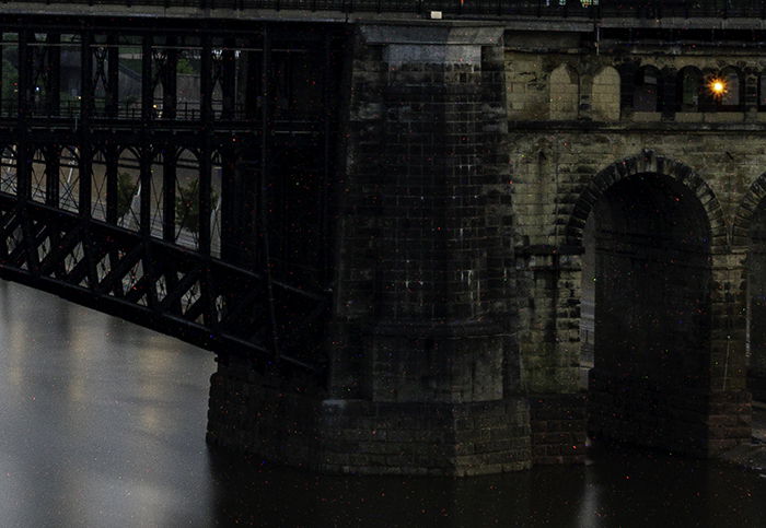 Shot of a bridge with long exposure and with color noise