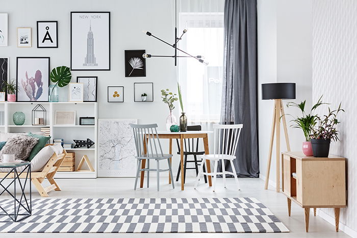 White and airy living area with small table for a real estate photography shoot