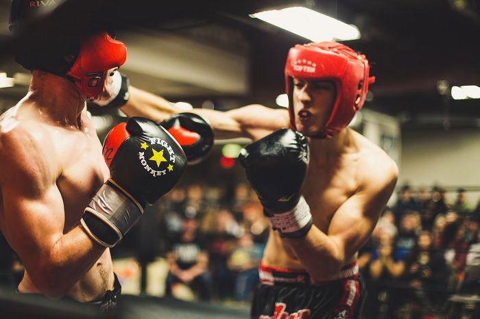 Two young boxers slugging it out in the ring