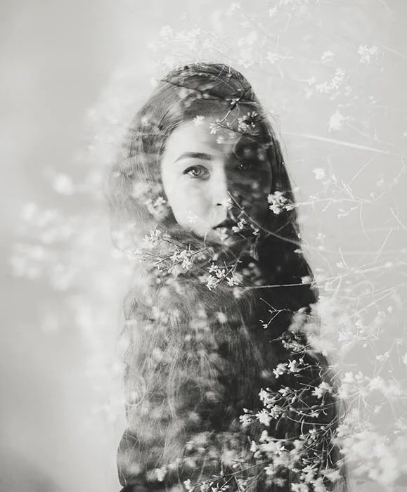 Double exposure of girl and some flowers
