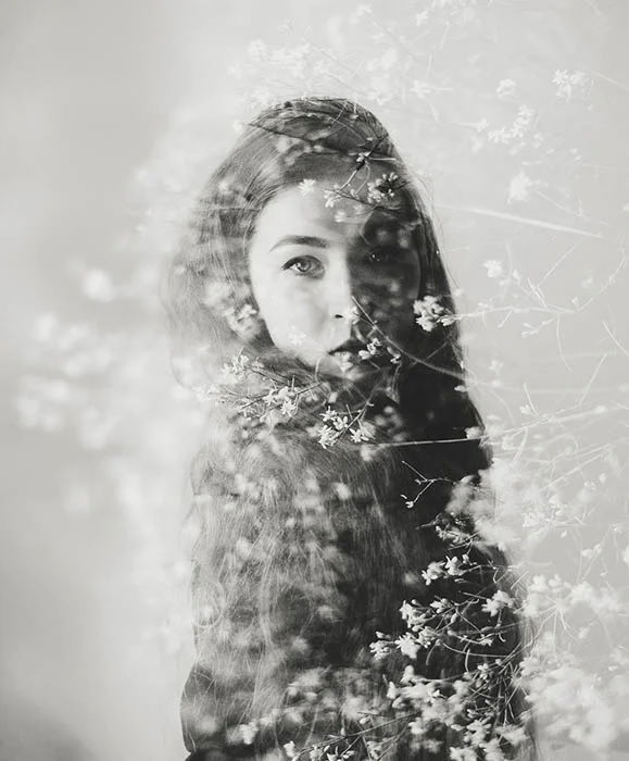 Double exposure of girl and some flowers