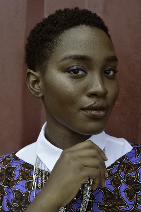 Portrait as a type of photography, showing a woman with short hair and blue top