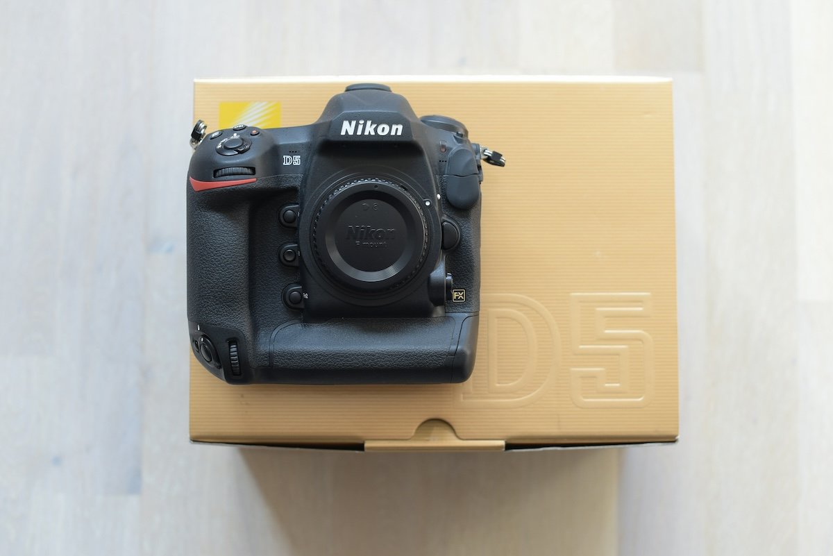 A new Nikon D5 siting on top of its product box