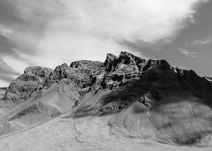 Black and white photo of a rocky mountain top