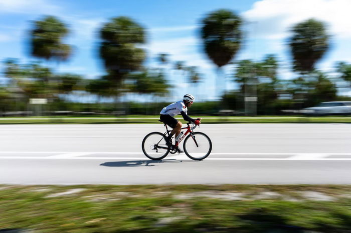 Cyclists speeding a long the road