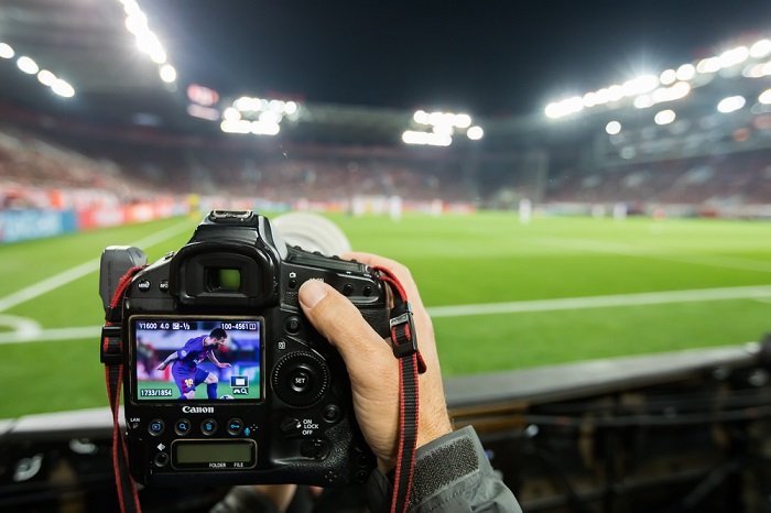 Back of a sports photographer's digital camera at a football match