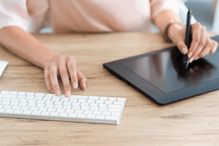 Pen tablet in use at a desk with a keyboard