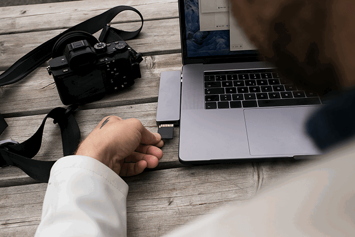 Photographer using an SD card reader