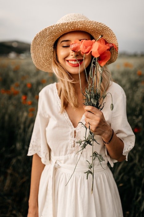 girl posing in flower field 