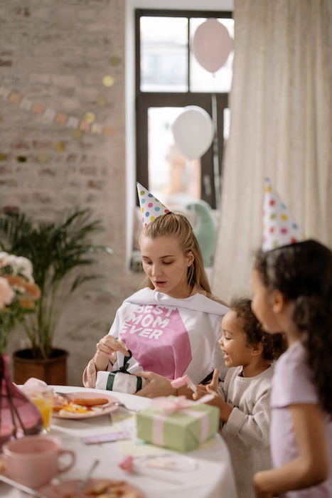 woman opening birthday presents 