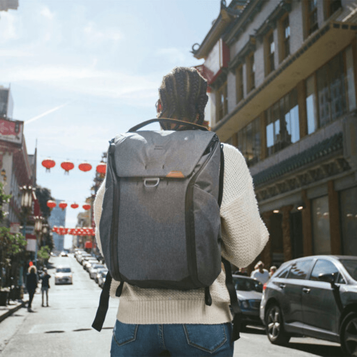 Man wearing an ash Peak Design Everyday Backpack