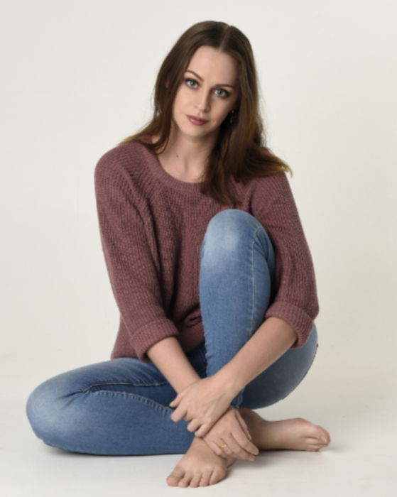 Young Woman Posing On Chair