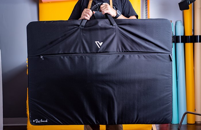 Holding up a full V-Flat World Duo Board bag