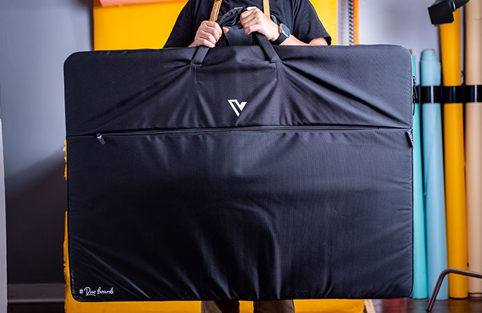 Holding up a full V-Flat World Duo Board bag