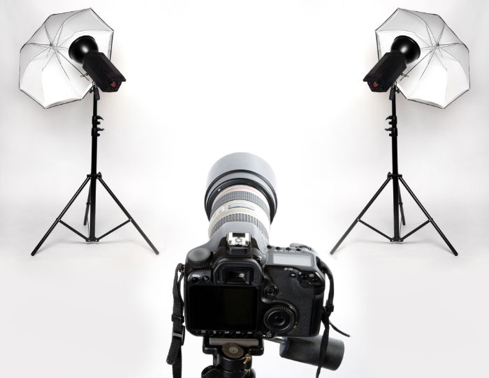 A camera and dual flash setup in a studio