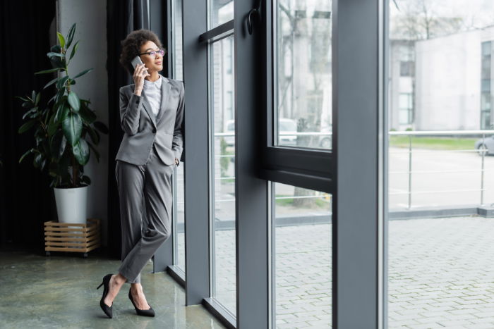 Woman leaning against door