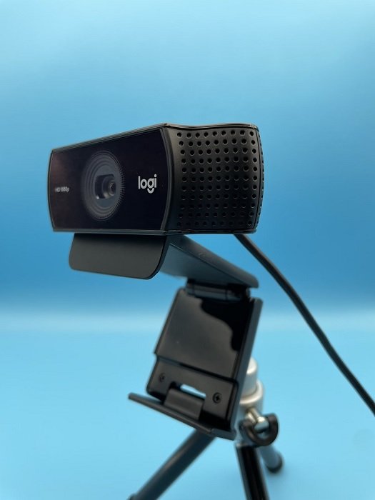 Logitech webcam against a blue background